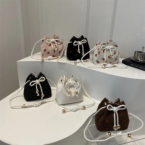 Chic corduroy drawstring bucket bags with strawberry patterns in six vibrant colors
