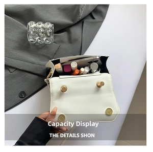 Interior view of small white square bag showing capacity for phone and cosmetics
