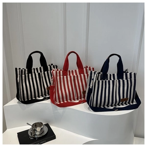 Vertical striped canvas tote bags in three colors with shoulder straps for daily use