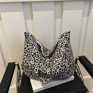 Large leopard print canvas tote bag with white zipper closure for daily commute and travel