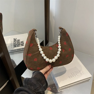 Brown corduroy shoulder bag with strawberry print and elegant pearl chain strap handle