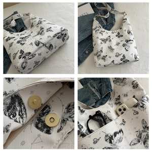 Détail du sac cabas blanc à motif papillon avec fermoir aimanté et rangement interne