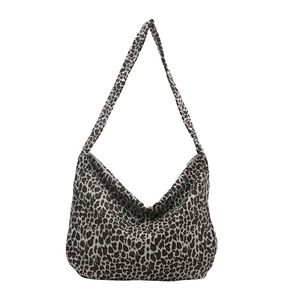 Large leopard print canvas hobo tote bag for women featuring a stylish shoulder strap