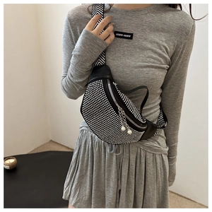 Detail of rhinestone crossbody chest bag with pearl chain and woven shoulder strap