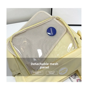 Detail view of the yellow ita bag featuring a clear window and removable mesh insert board