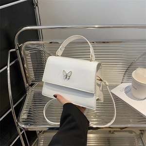 Elegant white square handbag with butterfly clasp and top handle for women
