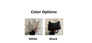 Détails du sac hobo en similicuir noir et blanc avec une forme moderne de demi-lune