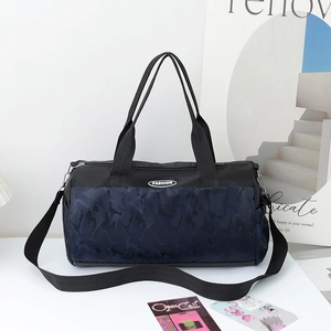 Large blue camouflage duffel bag with black handles and adjustable shoulder strap