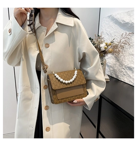 Brown monogram crossbody bag with elegant pearl handle and vintage printed lettering pattern