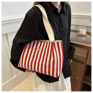 French style red and white striped canvas tote bag with wide cream shoulder strap