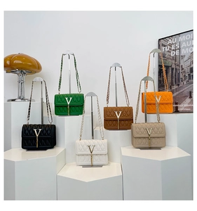 Quilted crossbody chain bag display in multiple colors with V-logo and fringe tassel detail