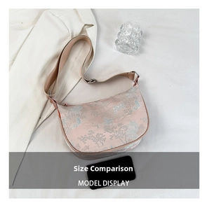 Detail of pink Chinese jacquard silk moon bag with classical architecture pattern