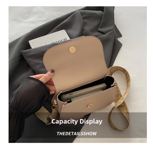 Interior view showing the smartphone storage capacity of a beige leather crossbody bag