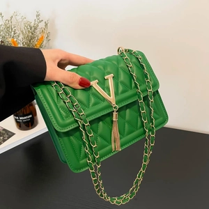Green quilted shoulder bag with gold V-logo and metallic chain strap for women