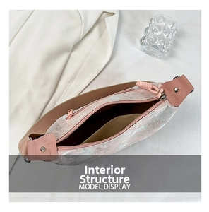 Top view showing the internal structure and pink jacquard lining of the crossbody bag