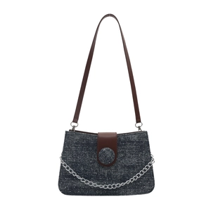 Sparkling dark blue tote with brown leather strap and silver chain detail for women