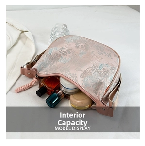 Interior view showing the large capacity of the pink jacquard silk shoulder bag