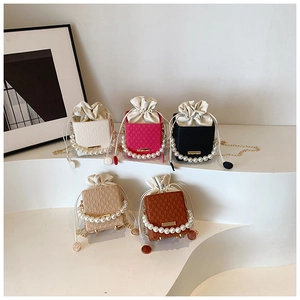 Close-up of mini bucket bags with pearl handles, lattice patterns and drawstring liners