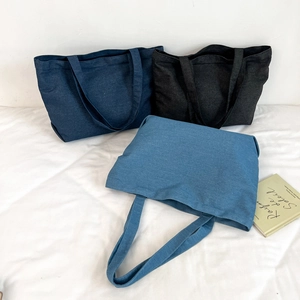 Three large canvas tote bags in navy, charcoal black and light blue denim style