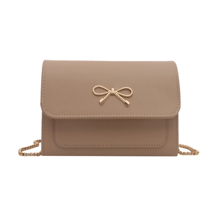 Elegant pink crossbody chain bag for women with golden bow hardware and flap closure
