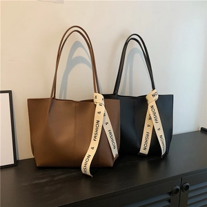 Classic large capacity tote bags in black and brown leather with fashion ribbon straps