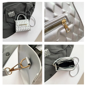 Detailed view of silver quilted crossbody bag with gold zippers and pearlized texture