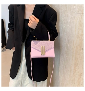 Pink crossbody bag featuring sparkly sequin flap detail and golden metallic bars