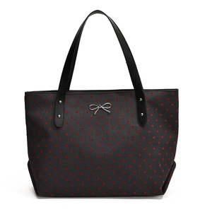 Large black tote bag with red heart pattern and silver bow detail for office commuting