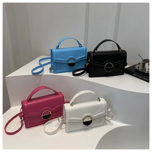 Chic small square handbags in blue, black, pink, and white with metal locks on tiered stand