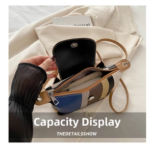 Détail montrant le rangement interne pour téléphone et portefeuille du sac bandoulière