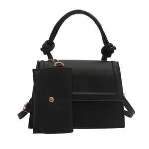 Chic black structured faux leather handbag with knot handle and small pendant coin purse