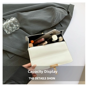Interior view showing the storage capacity for a smartphone and cosmetics in white bag