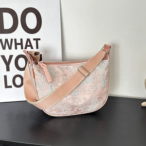 Pink silk jacquard crescent bag with traditional landscape pattern and wide strap