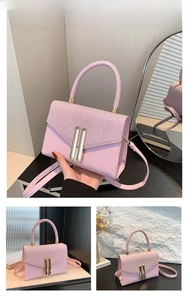Detail of pink patchwork crossbody bag with metallic magnetic buckle and round handle