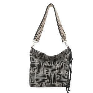 Bohemian black and white geometric canvas shoulder bag with adjustable strap and tassel