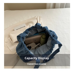Interior view of large capacity denim tote bag showing umbrella, book and essentials