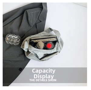 Top view of spacious grey canvas tote bag showing interior space for water bottle and tablet
