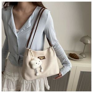 Chic cream waffle fabric shoulder bag with brown straps and cute cloud charm detail