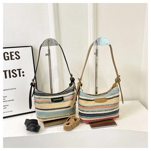 Retro woven striped bucket bag with leather strap and metal plate in two colorways