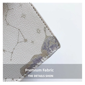 Detail of cross-grain textured fabric with lavender print and neat edge stitching