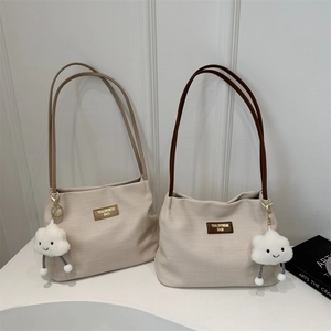 Minimalist canvas shoulder tote bags in cream white with cloud charms and leather straps