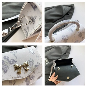 Detail shots of butterfly print handbag showing metal bow clasp and detachable strap
