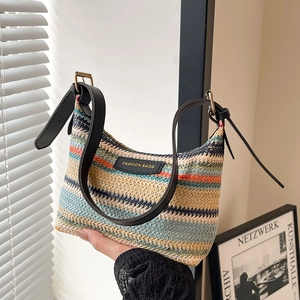 Fashionable rainbow striped woven crossbody bag with adjustable black leather shoulder strap