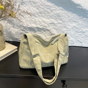 Soft leather tote bag with pleated texture and adjustable shoulder strap for women