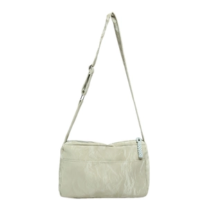 Minimalist light green tote bag in wrinkled nylon fabric with adjustable shoulder strap