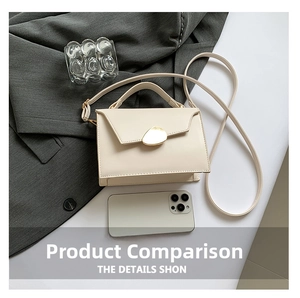 Detailed view of cream crossbody bag with gold buckle and smartphone for size comparison