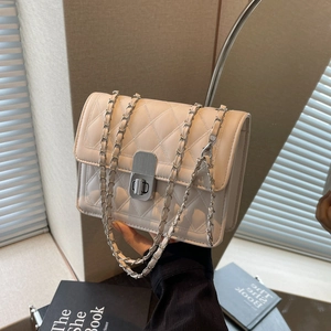 Chic beige quilted crossbody bag with silver chain strap and metal turn-lock closure