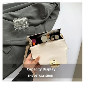 Top view of cream white handbag interior showing capacity for phone and cosmetics