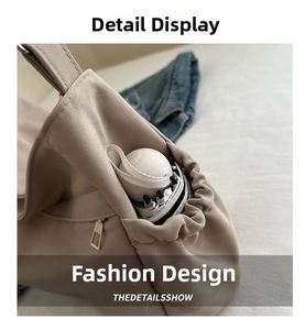Practical side drawstring pocket on khaki canvas tote bag holding a white umbrella