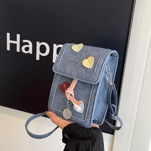 Cute blue denim crossbody phone bag with heart patches and colorful pendant charms